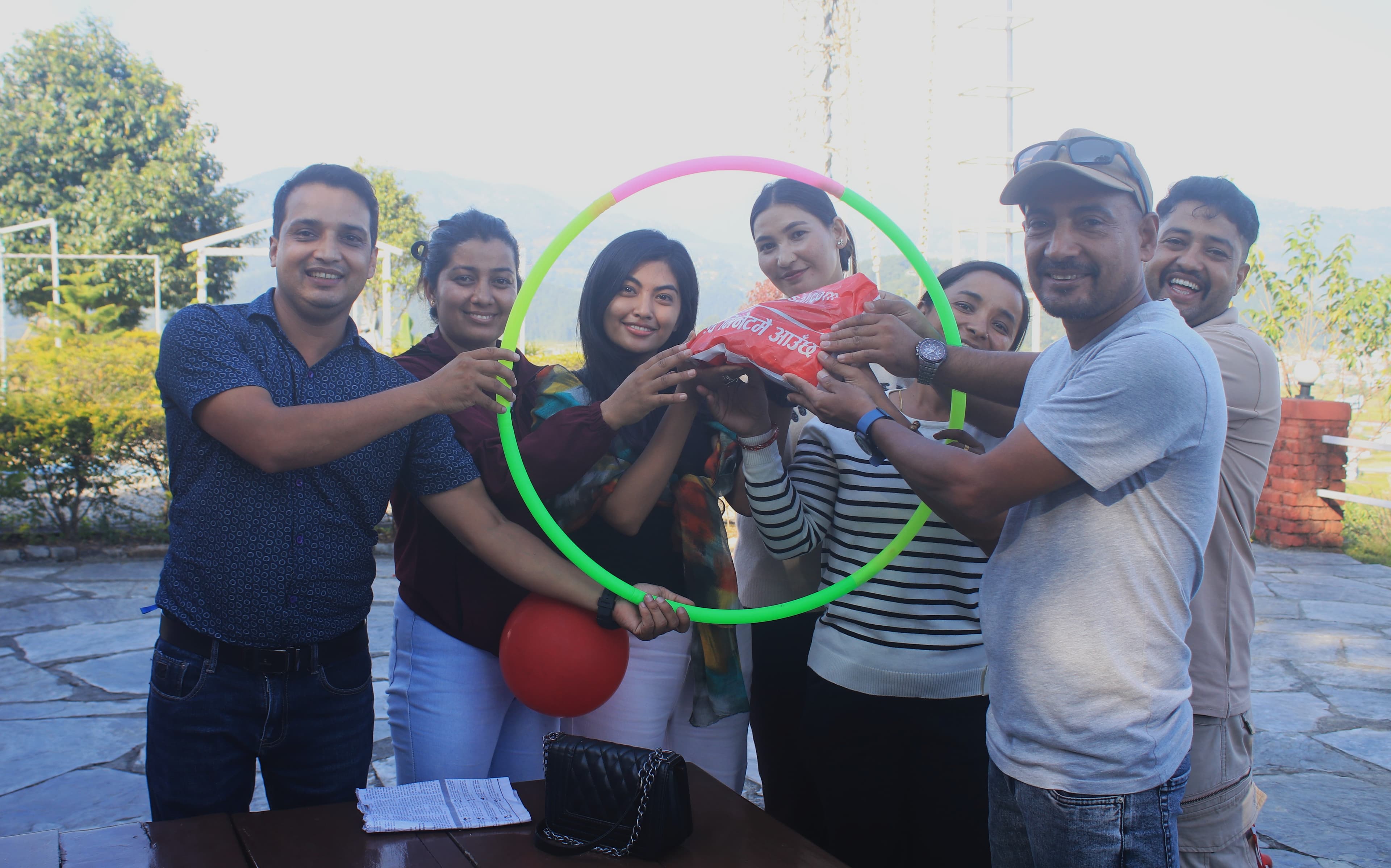 Winner of the refreshment program receiving a prize from CEO Anil Paudel