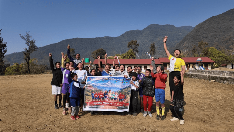 Some of the children with their poster supplied by a local sponsor with their motto: ‘run for fun, together we run!’